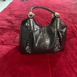 Beautiful Brahmin purse. Placed next to Windex so you can see heighth